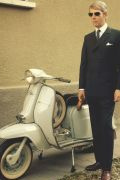 Photo 2 from album Driving a scooter in a suit